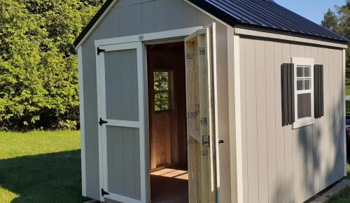 Cottage storage shed open door