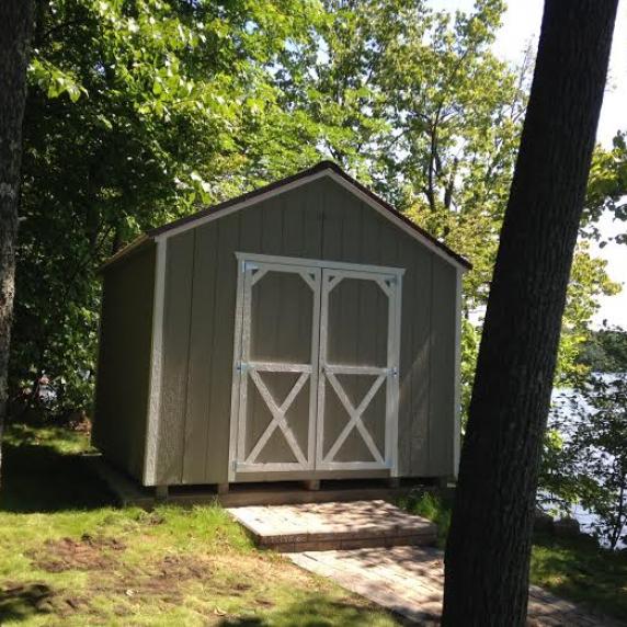 10x10 cottage style shed on cement pad by the water