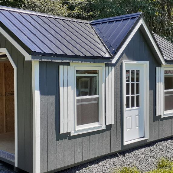 Chalet storage shed with garage door