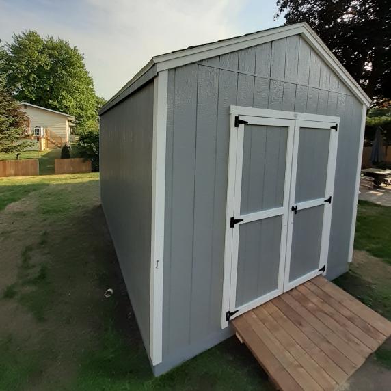 Cottage storage shed with ramp
